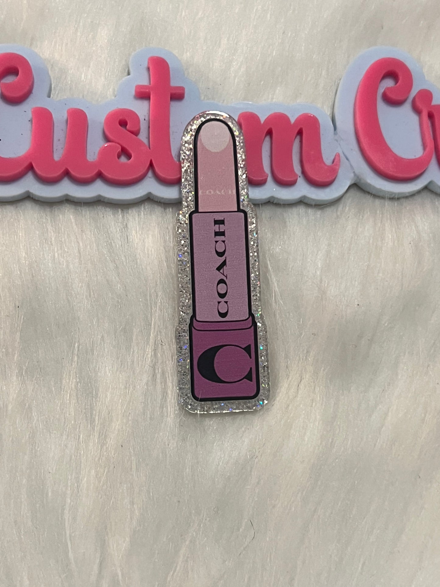 Purple Coach lipstick