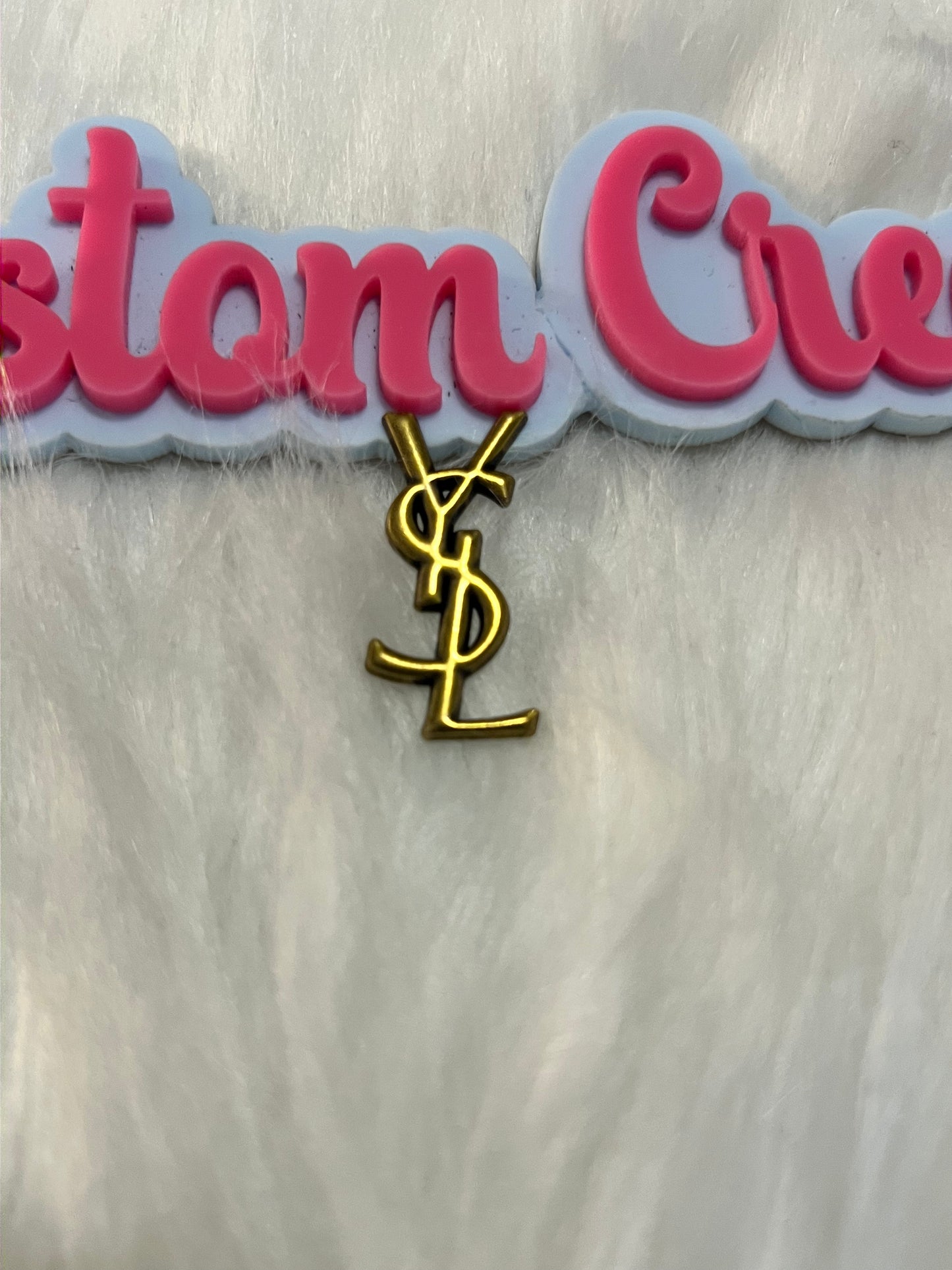Gold YSL charm