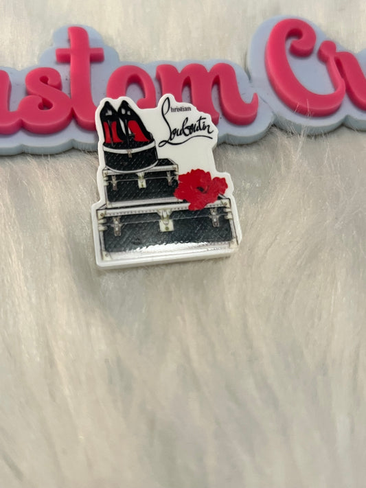 Red Bottle on suitcase
