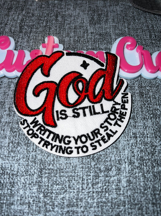Faith Statement Iron-On Patch – “God Is Still Writing Your Story” Embroidered Patch