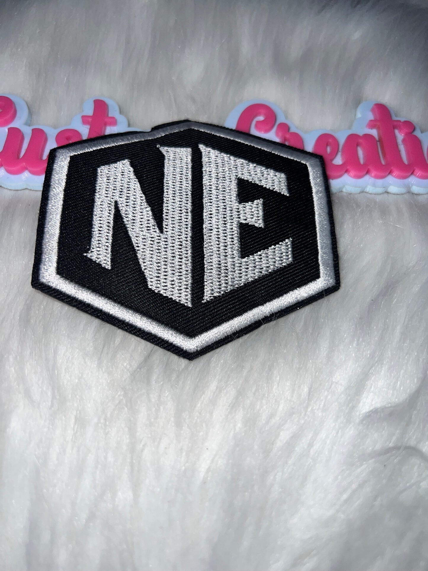 NE Logo Patch – Black & White Iron-On Patch