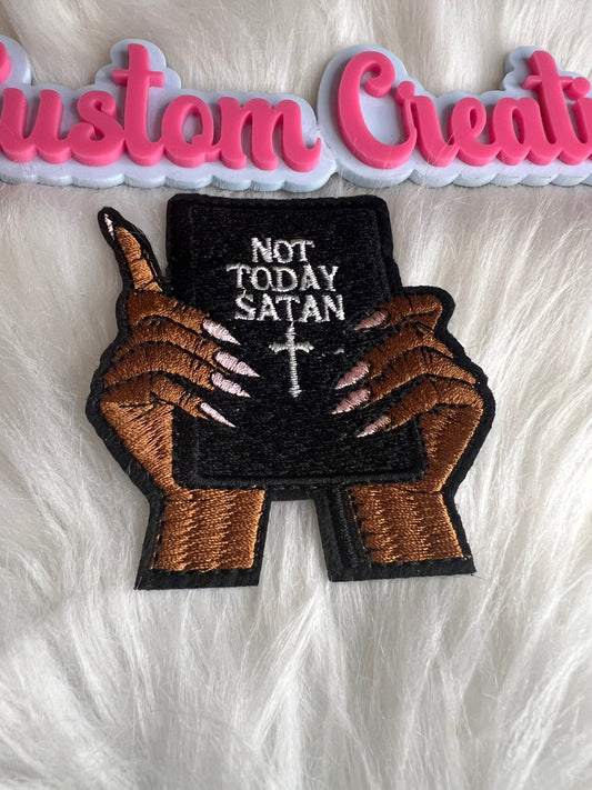 Hands with Not today Satan book